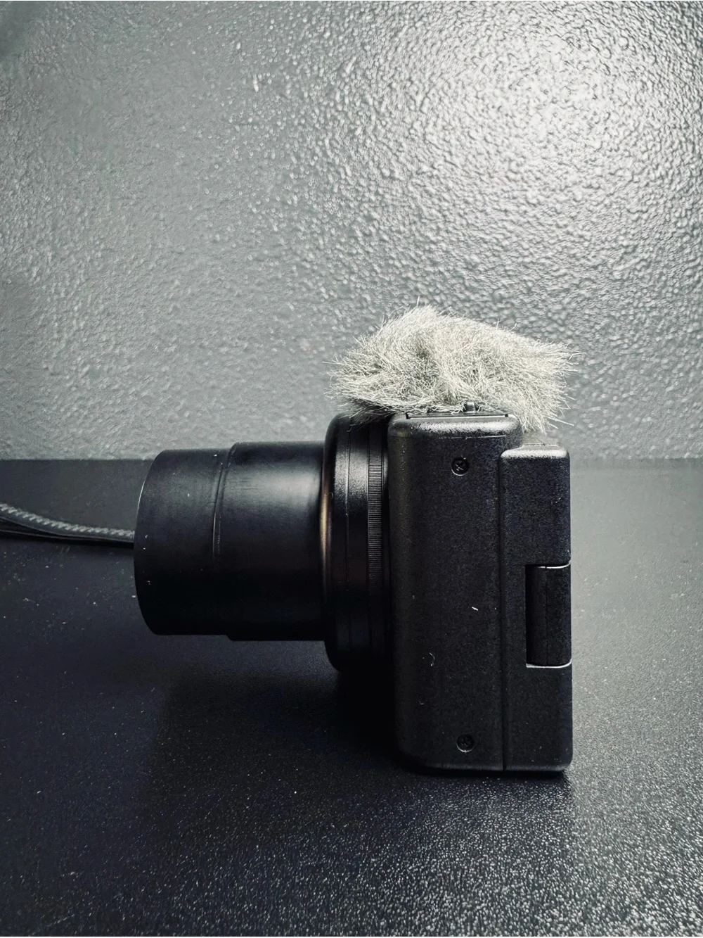 Sony Black Compact Digital Camera with Zeiss Lens and Wind Muff